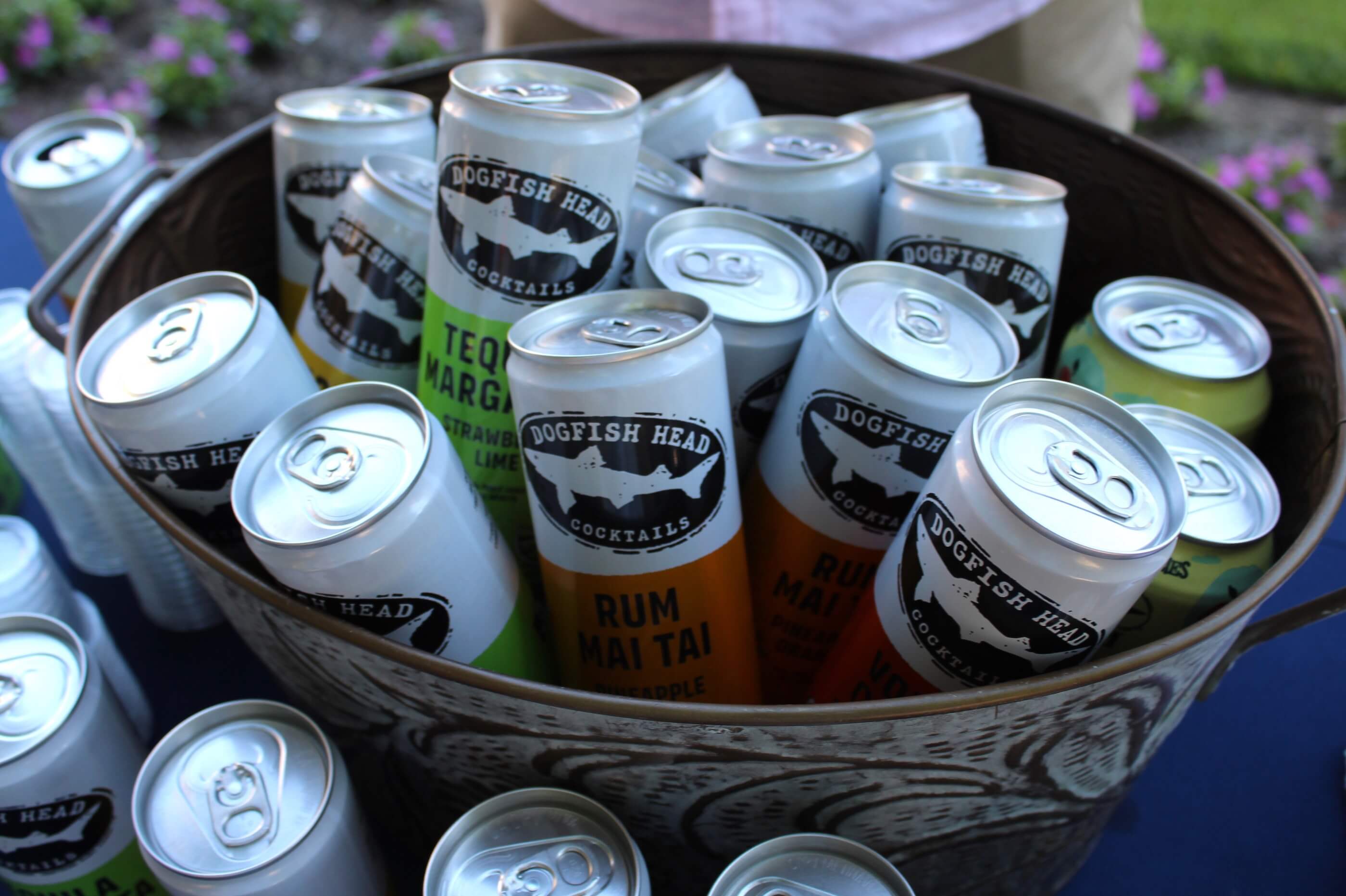 A bucket filled with cocktail cans from Dogfish Head