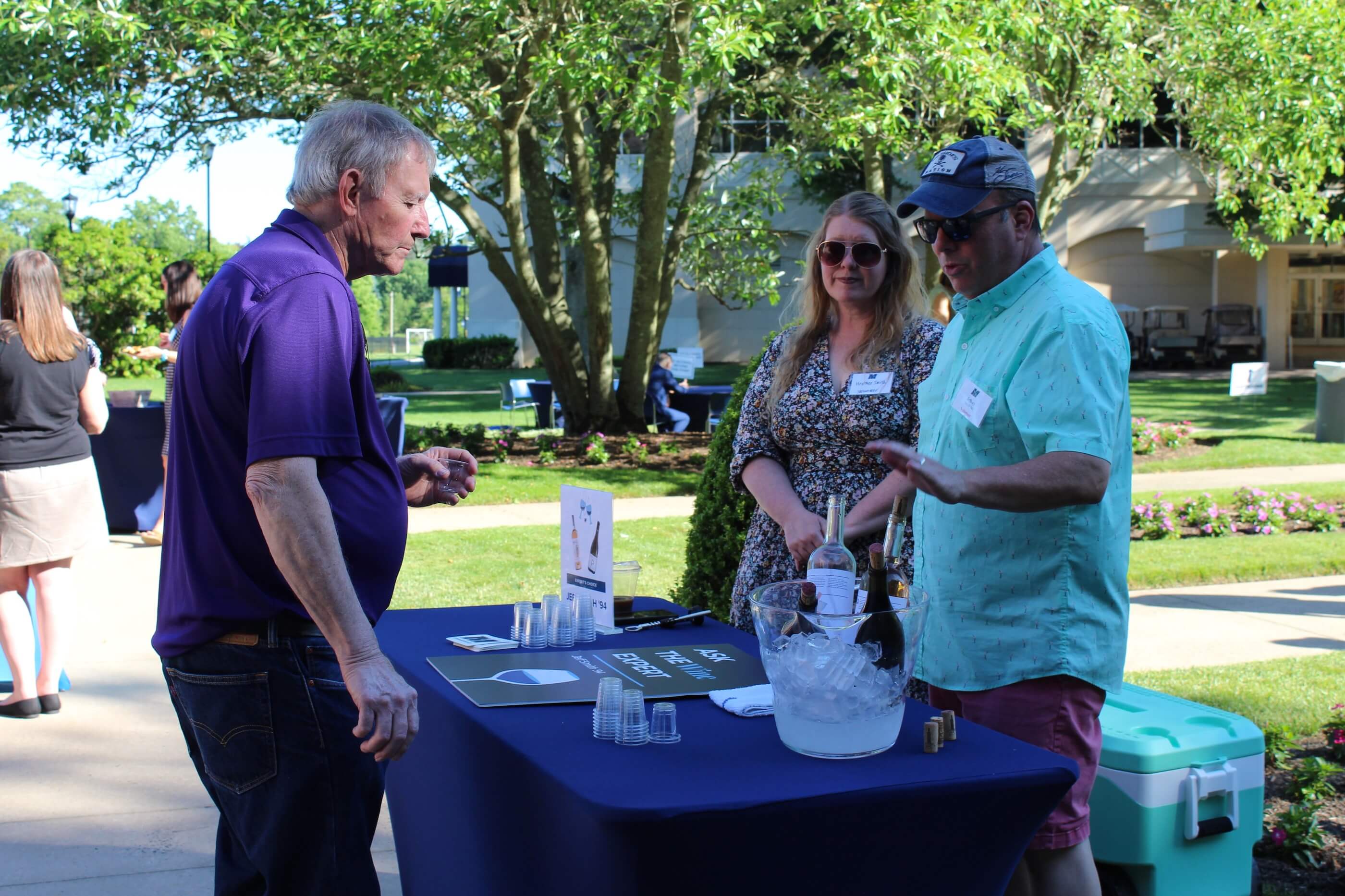 Wine expert speaks to event attendee