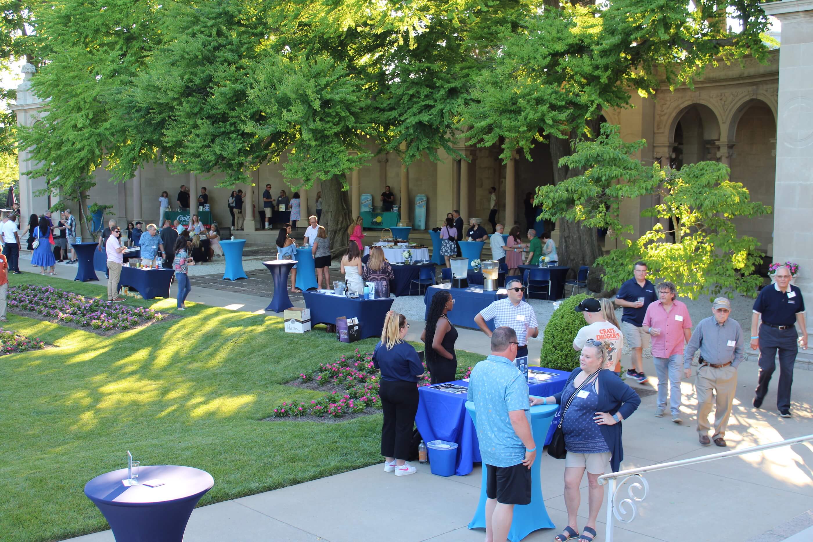 Wine vs Stein attendees talking among each other in Erlanger Gardens