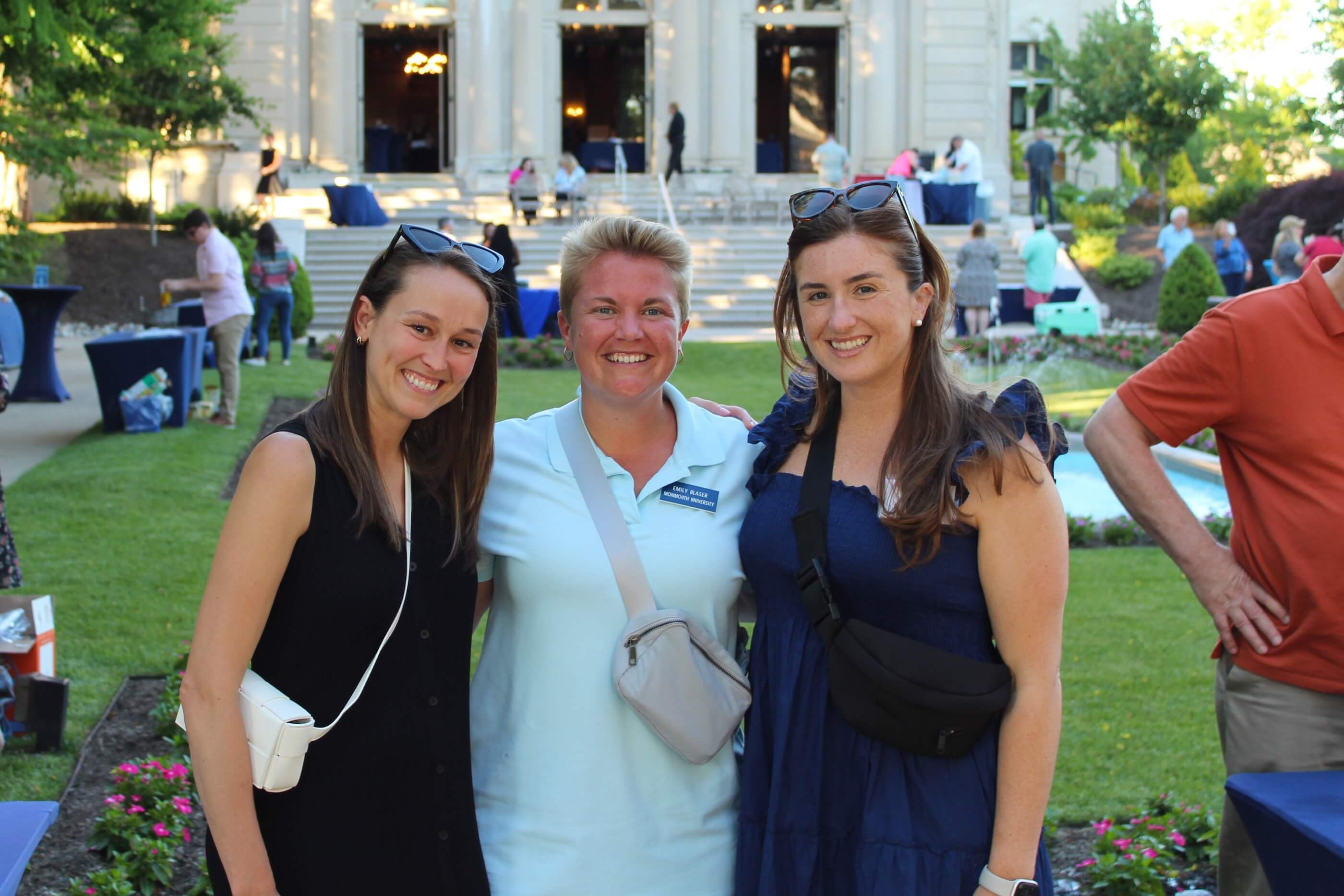 Three women posing for a group shot near Erlanger Gardens