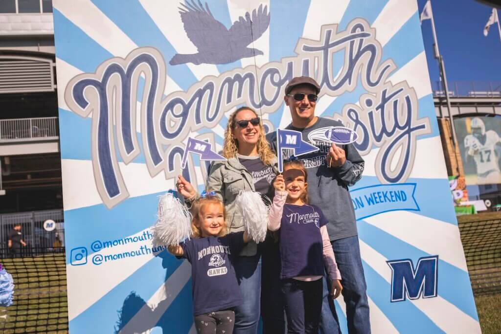 Family in monmouth gear at photobooth