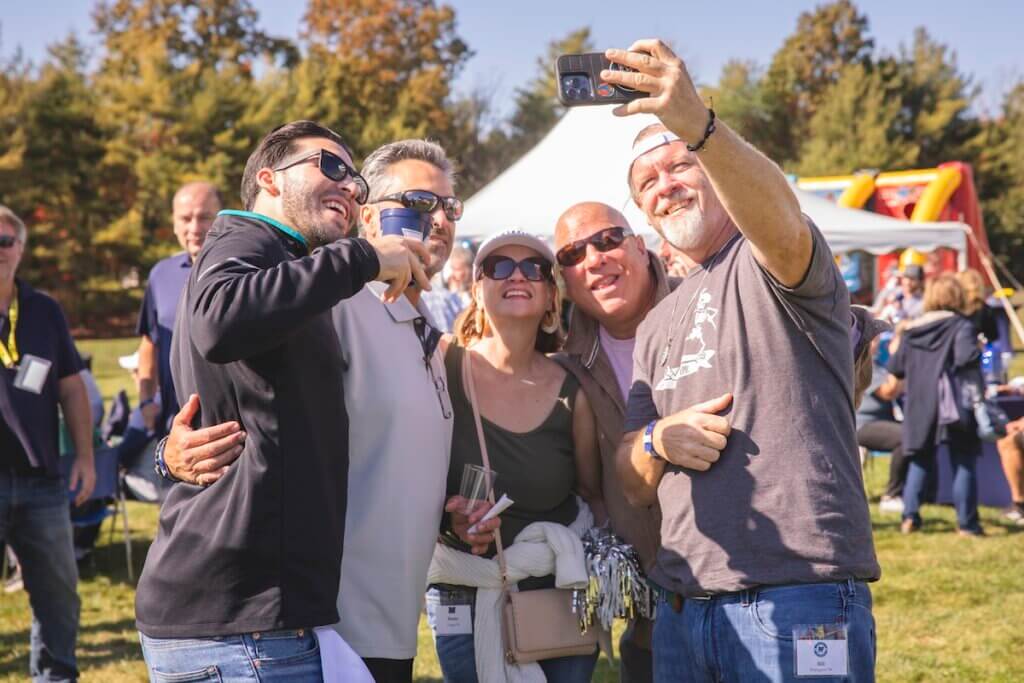 Group of adults taking a selfie