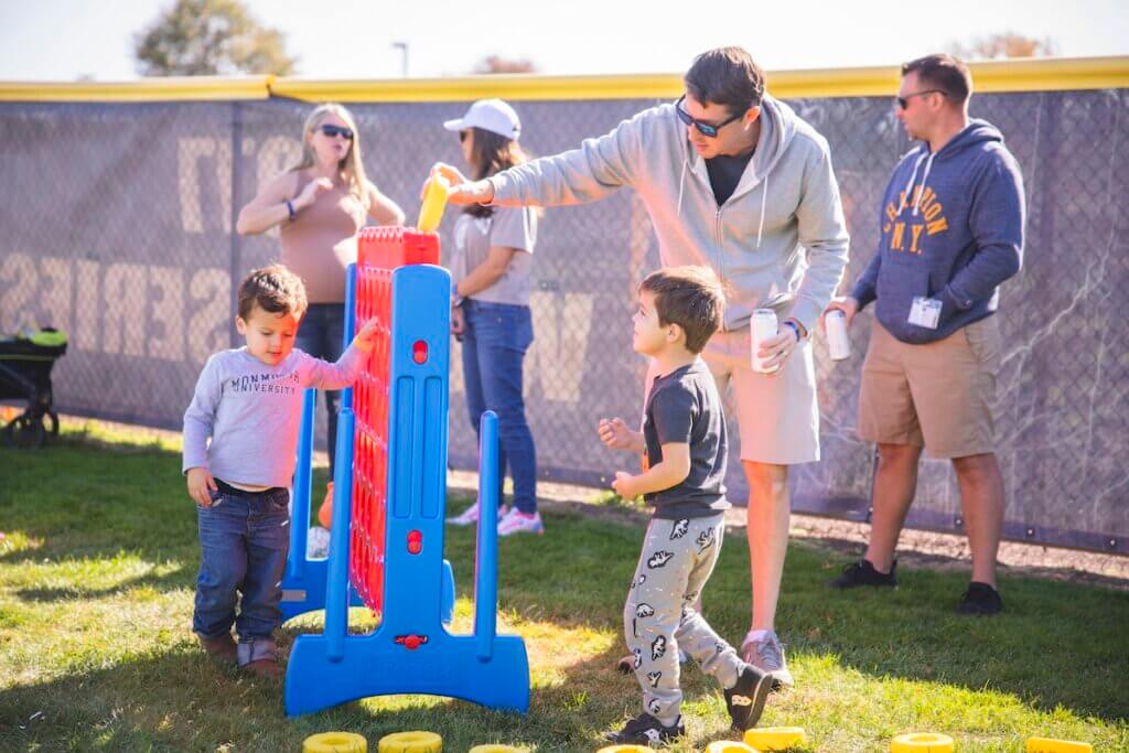 Kids playing a jumbo version of connect 4