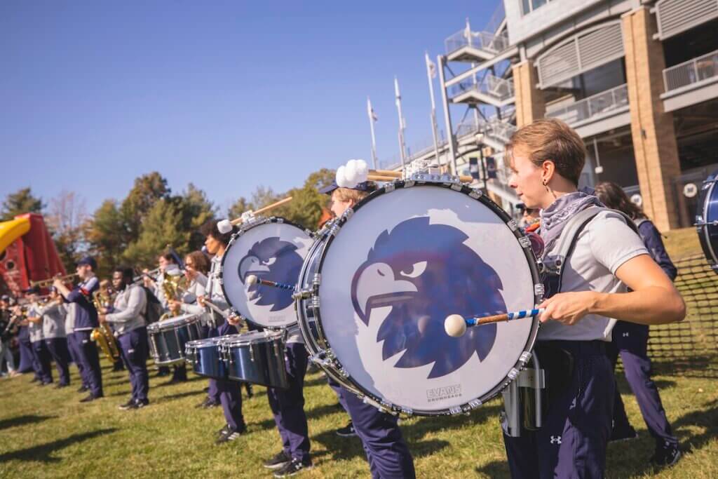 Marching band performing outside the stadium