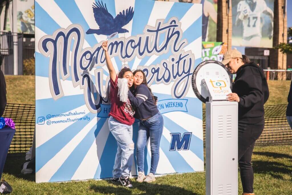 two alumnae at photobooth