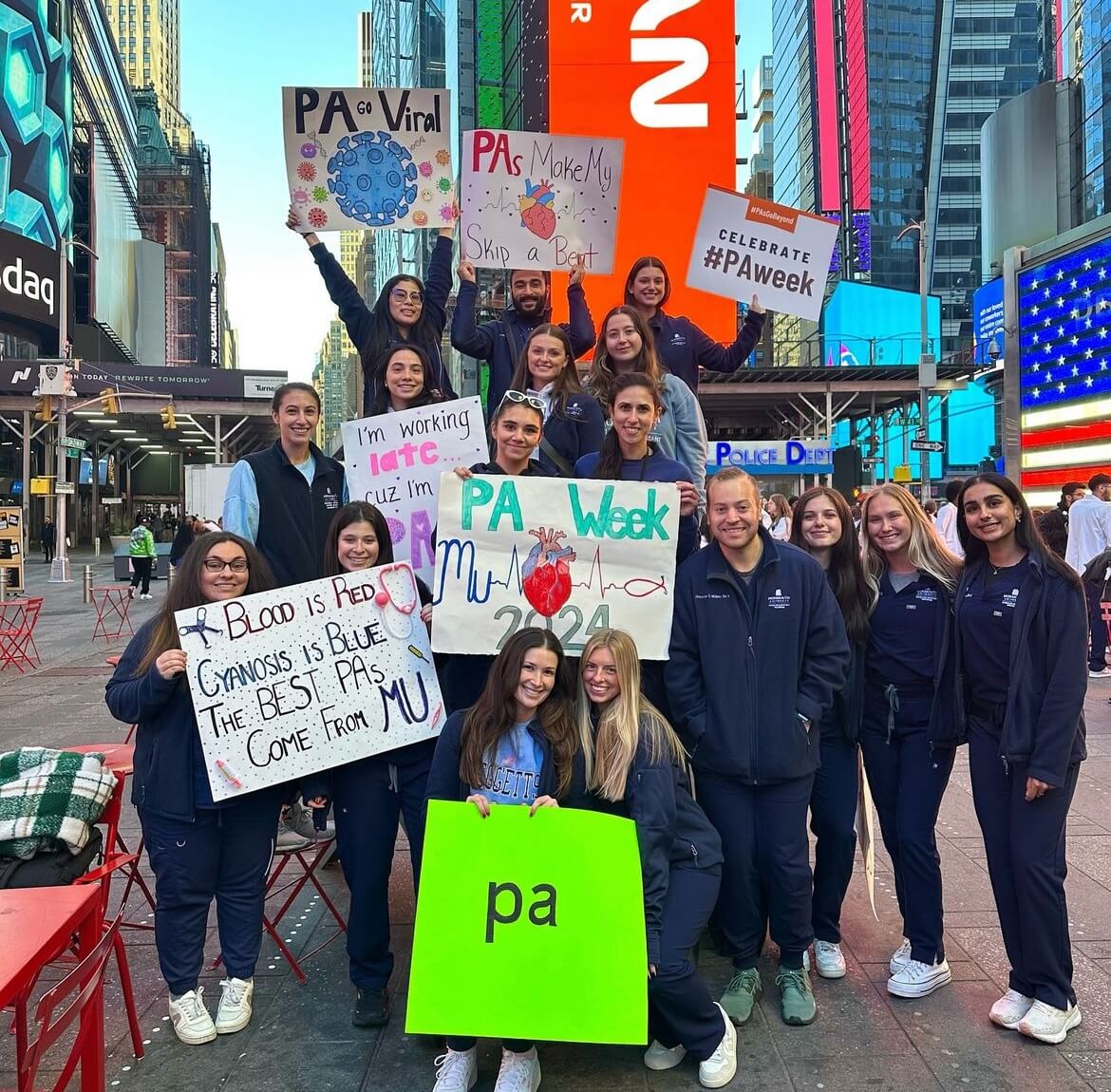 Group of students holding signs in support of Physician Assistants in Time Square, New York City.