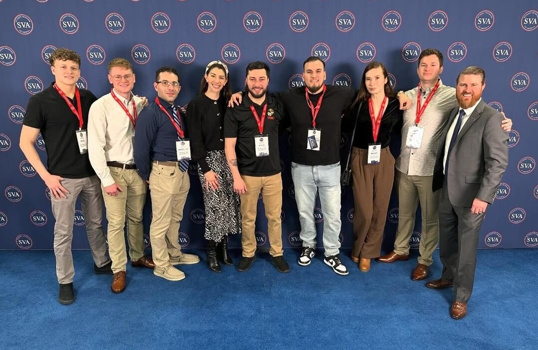 9 students picture in business casual at the SVA National Convention.