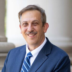 Provost Rich Veit stands outside the Great Hall