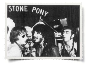 Archival black and white photo of Bruce Springsteen and SouthSide Johnny