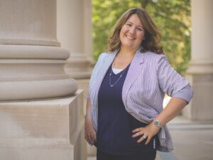 Alyson Pompeo-Fargnoli stands at entrance of Great Hall