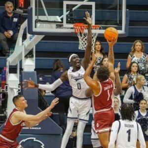 Dok Muordar defends basket against College of Charleston