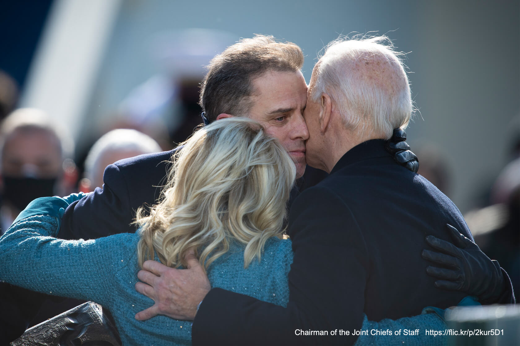 Image of Hunter, Jill and President Biden embracing.