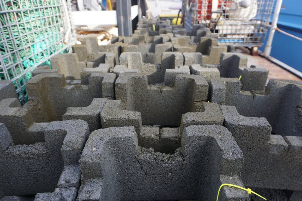 A stack of oyster castle blocks aboard a vessel.